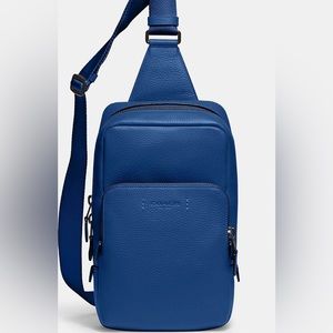 Coach Gotham Sling Pack Blue Fin in excellent used condition.